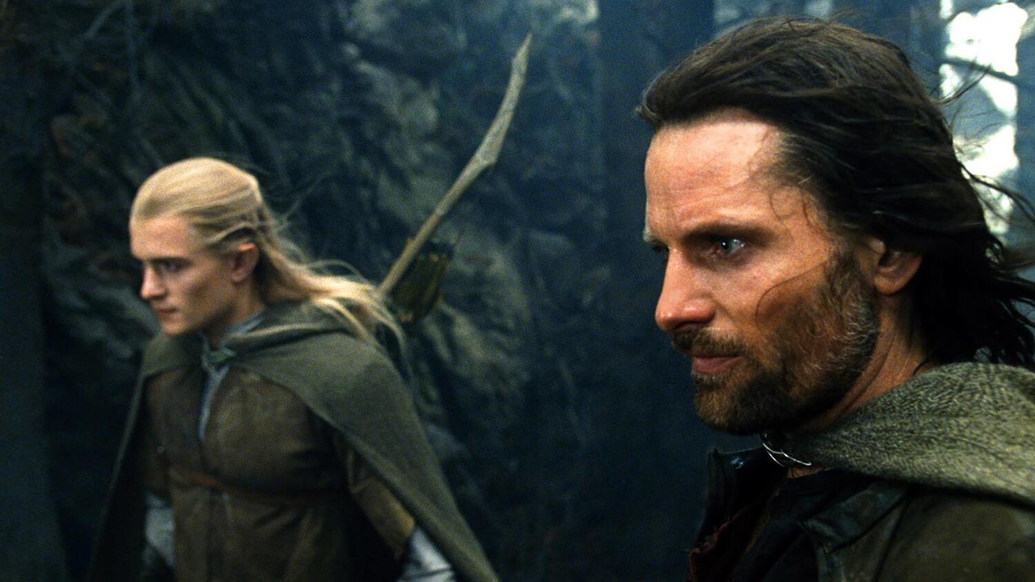 Bloomin Legolas-hahmo vasemmalla. Oikealla Viggo Mortensenin esittämä Aragorn.