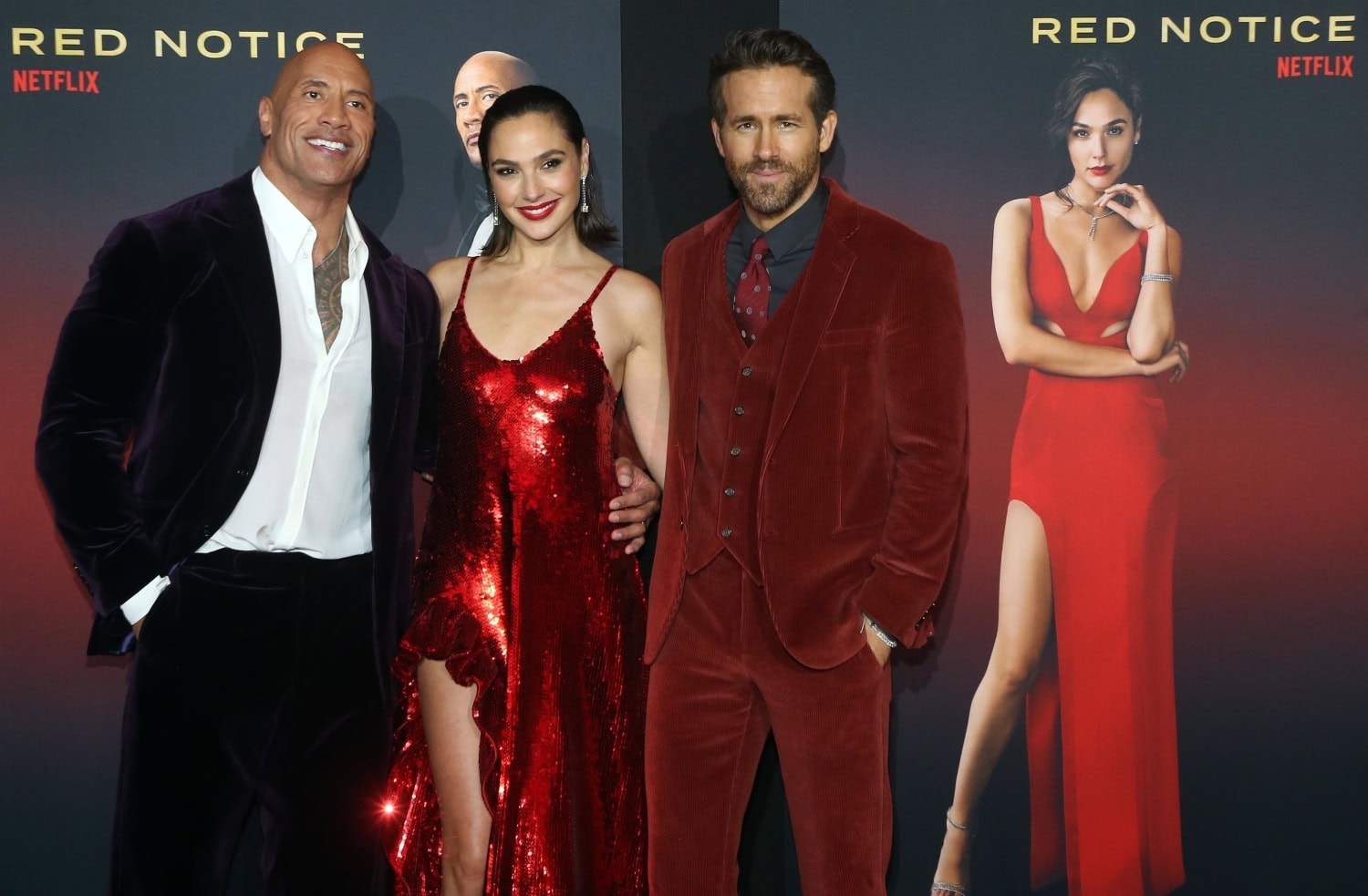 Dwayne Johnson, Gal Gadot ja Ryan Reynolds.